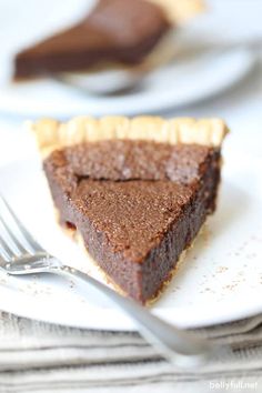 a slice of chocolate pie on a plate with a fork