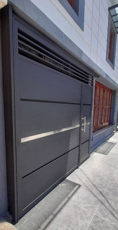 the side of a building with a large garage door