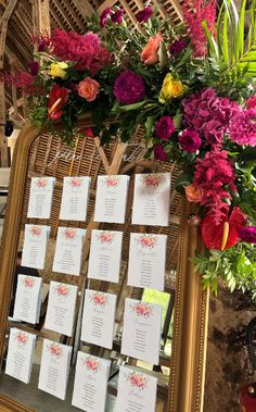 a table with flowers and place cards on it