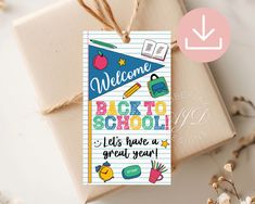 a welcome back to school card is tied up with twine