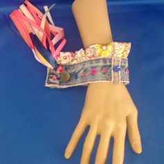 a mannequin's hand with bracelets on it