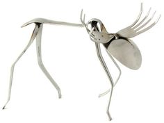 a metal insect sculpture on a white background