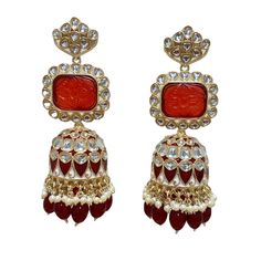 The Maroon Jiya Earrings are unique, and lightweight Jhumkas with Kundan, Meenakari and Gold-Plating on beautiful hydro beads. Specifications Materials used: Kundan, Meenakari, hydro beads, Gold Plating Weight: 41 g Height: 3.5 inches At Romikas, we pride ourselves on the craftsmanship and high quality of our jewelry, designed to enhance your natural beauty. Please contact us with any questions. Red Jhumkas With Latkans For Puja, Handmade Bollywood Jhumkas For Navratri, Fusion Style Tilla Earrings For Eid, Red Latkans Jhumkas For Puja, Red Temple Jewelry Jhumkas For Celebration, Festive Red Temple Jewelry Jhumkas, Traditional Heavy Danglers For Puja, Handmade Red Kundan Earrings, Fusion Style Jhumkas With Latkans For Gift