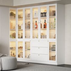 a living room filled with lots of white furniture