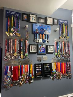 a wall with many medals hanging on it