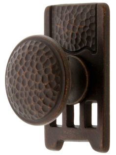 an antique style door handle with two knobs