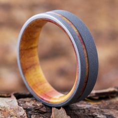 a wooden ring sitting on top of a rock