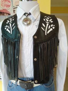 "Great condition, motorcycle vest with floral inlay top stitched design Leather is Firm to service its purpose. Measurements: Across Shoulders 15\" Shoulder Seams 4.5\" Wide Bust - Chest 38\" Length, Shoulder Seams to Waist at Longest Point - 21\" Fringing Back and Front 8\" Long Two Front Pockets 5\" Wide x 5\" Deep V-Neckline 10\" Deep" Biker Style Fitted Vest For Festivals, Fitted Biker Vest For Festivals, Fitted Western Vest For Spring, Western Style Fitted Vest For Spring, Spring Fitted Western Vest, Cowboy Vest, Western Vest, Badass Outfit, Motorcycle Vest