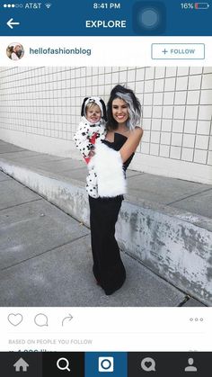 a woman holding a child dressed in dalmatian costume for halloween on instagram