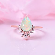 Welo opal is believed to be an emotional intensifier, enhancing the true nature of those who wear it. Some say it strengthens the will to live and shields the wearer against negativity. It is known for supporting spiritual growth and love. Gemstone: Premium Garde Welo Opal Accent With Moissanite Stone Shape/ Size: Pear Shaped 8X6MM Metal Type: 925 Sterling Silver/ Solid14K Gold Also Available Finish Type:  In 925 Sterling Silver below Finish Types are Available: White Rhodium-Silver / 14K Yellow /14K Rose Gold Overlay. In Solid 14K Gold below type can order: Solid 14K White /Rose/Yellow Gold. Natural Welo Opal Ring, Engagement Rings, Bridesmaid Gifts, Pear Shaped Opal, Ring For Women, Gifts For Her, Women Ring, Ethiopian Welo Opal Opal Ring Engagement, Welo Opal Ring, Will To Live, Dark Sapphire, Engagement Rings Opal, True Nature, Pretty Rings, Women Ring, Women Gifts