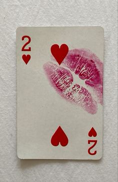 a playing card with two hearts on it