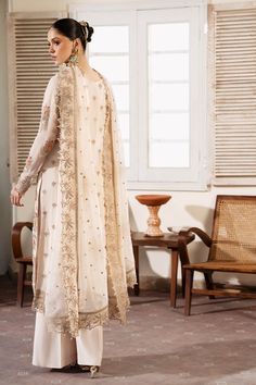 Brand: Serene PremiumProduct Code: S-1081 PerleCollection: Serene Premium Embroidered Muse Luxury Chiffon CollectionFabric: Chiffon DESIGN DETAILS: Embroidered & Hand Embellished Chiffon Front Embroidered Organza Front Open Border Embroidered Chiffon Back Embroidered Organza Front Back Border Embroidered Chiffon Sleeves Embroidered Organza Sleeves Border Embroidered Chiffon Dupatta Dyed Raw-silk Trousers DISCLAIMER:* Lining, Laces, and Tassels are not included in unstitched variants.* Embellishment items in stitched outfits are subject to market availability.* The actual colors of the outfit may vary from the colors being displayed on your device. CARE INSTRUCTIONS: Extra Fabric Has Been Used For Shoot Original Color May Vary Slightly From The Picture Dry Clean Recommended Iron The Clothes Batik Print Dress, Salwar Suits Party Wear, Indian Anarkali, Lehenga Jewellery, Saree Sale, Chiffon Sleeves, Organza Sleeves, Lehenga Style, Chiffon Collection