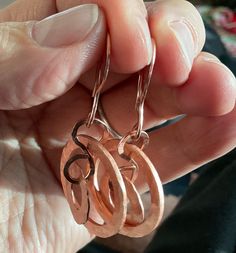 Hand Hammered Pure Copper Dangley earrings With Hand Hammer Copper earwires to match. Just Beautiful We generally use these for gifting to others. Each pair is unique but similar in size. These can be customized if you want a longer length either rochelle each pair is unique but similar in size. These can be customized if you want a longer length either with dentalium shell in green or white or additional copper dangles, please message me for quote. Tots-May-Way, Tonya Hoches Hammered Copper Hoop Earrings As Gift, Hammered Copper Earrings For Gift, Copper Hammered Hoop Earrings As Gift, Hammered Rose Gold Copper Earrings, Handmade Copper Wrap Earrings For Gift, Copper Dangle Hoop Earrings Gift, Copper Wrap Earrings With Ear Wire As Gift, Unique Hand Forged Rose Gold Earrings, Hand Forged Copper Wire Earrings For Gift