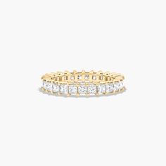 This timeless eternity ring features the boldness and intense sparkle of princess cut diamonds. A classic, tailored shared prongs setting allows the maximum amount of the diamonds surface to show. *Number of diamonds and carat total weight will vary depending on ring size. Princess Cut Gold, Yellow Sapphire Rings, Rings Mens Wedding Bands, Classic Wedding Rings, Platinum Wedding Rings, Pink Sapphire Ring, Round Cut Engagement Rings, Men Diamond Ring, Gold Pearl Earrings