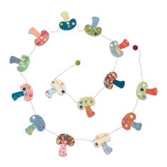 an assortment of colorful wooden toys are arranged in a circle