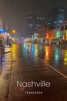 a city street at night with the name nashville on it and buildings in the background