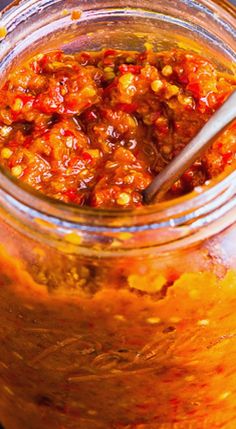 a jar filled with food sitting on top of a table