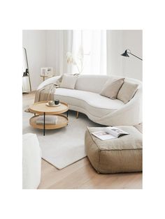 a living room filled with furniture and a white rug