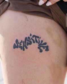 a woman's thigh with the word stencil written on it in black ink