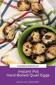 a green bowl filled with hard boiled quail eggs on top of a colorful towel