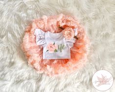 ♥ Floral Peach Watercolor "One"  Pettiskirt Tutu Set ♥ This adorable Tutu Pettiskirt is sure to be a special addition to your little one's wardrobe. It's perfect for cake smash photos! This pettiskirt is ultra fluffy! Bodysuit has 3 snap closure. The headband is soft and stretchy. Your choice of a flutter sleeve bodysuit, Gerber Onesie®, or Carter's Bodysuit. Now offering flutter sleeve bodysuits & leotards! Flutter sleeve bodysuits have snaps for diapering, the leotards do not. Made to last, we First Birthday Fitted Sets With Ruffles, Short Sleeve Clothing Sets For First Birthday In Spring, Fitted White Diaper Cover For First Birthday, Cute Ruffled Sets For First Birthday, Summer Birthday Sets With Ruffles, Summer Birthday Ruffled Sets, Pink Ruffled Birthday Set, White Short Sleeve Birthday Set, White Short Sleeve Sets For Birthday