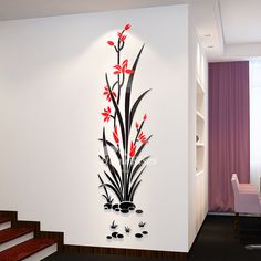 the wall is decorated with red flowers and black leaves, along with steps leading up to it