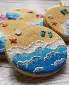 cookies decorated with sea animals and seashells on a table