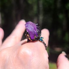 This Is A Beautiful Huge Raw Amethyst Crystal Set On A 925 Sterling Silver Ring Covered With Rhodium And 24k Gold Accents. The Little Blue Stones Are Topaz. This Is A Perfect Cocktail Ring As Its Dramatic & Stunning! It Is A Size 8 With A Beaded Style Band. Please Ask Questions And Make An Offer. I Can't Say Yes If You Don't Ask! Unique Multi-stone Amethyst Ring, Amethyst Crystal Ring With Gemstone Accents For Gift, Unique Multi-stone Purple Amethyst Ring, Unique Purple Multi-stone Amethyst Ring, Spiritual Purple Crystal Birthstone Ring, Unique Purple Amethyst Ring With Accent Stones, Mystical Amethyst Purple Ring, Mystical Purple Amethyst Rings, Amethyst Multi-stone Crystal Ring As Gift