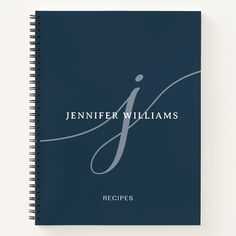 a spiral notebook with the words, recipes written in white ink on a dark blue background