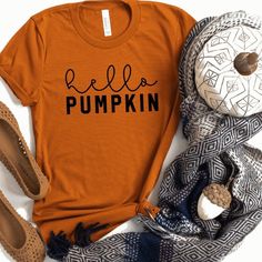 Thanks for checking out our Hello Pumpkin Shirt! Shirt pictured in burnt orange with black design and black shirt with white design. Great for Fall, Halloween and Thanksgiving; can easily dress this one up or down. ❤ EASY TO ORDER Select Style Shirt: Unisex Tee (pictured) Select Shirt Color: Burnt Orange (pictured), Gray, Black, Red, Pink, White, Blue or Charcoal. Select Vinyl Color: See Chart in Picture Above ❤ SHIRT SPECIFICATIONS & SIZING Unisex/Men's Tee: Lightweight and extra soft. 4.5- Embroidery Crewneck, Fall Tshirt, Pumpkin Spice Shirt, Fall Shirts Women, Blessed Shirt, Thankful Shirt, Hello Pumpkin, Embroidery Hoodie, Autumn T Shirts