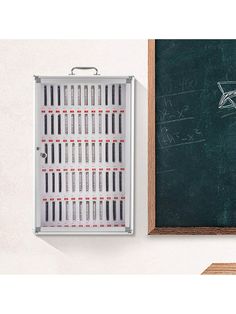 a blackboard with some writing on it next to a chalk board and an eraser