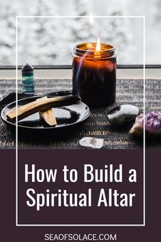 a candle and some rocks with the words how to build a ritual altar