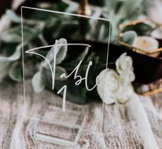 an acrylic table number with flowers on it