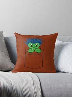 a cartoon character with blue hair sitting in a pocket throw pillow