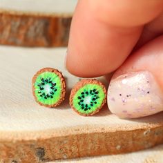 This Kiwi Stud Earrings is the cutest, one of a kind jewelry that you have been looking for! If you want to wear yummy fruit earrings or just searching for the perfect gift for girls, then you have came to the right place! D E T A I L S: * Handmade Kiwi Fruit Earrings * Made from Polymer Clay * Width: 0.4 inches (1 cm) * Earring posts: Stainless steel * Earrings are light and easy to wear * Earrings will arrive in a nicely packed eco friendly box 😉 Get -15% OFF from your order by purchasing 2 o Green Fruit Design Earrings For Gifts, Gift Green Earrings With Fruit Design, Green Fruit Design Earrings Gift, Green Fruit Design Earrings As Gift, Eco Gift Wrapping, Yummy Fruit, Fruit Jewelry, Food Earrings, Fruit Earrings