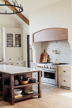 a kitchen with an island in the middle of it