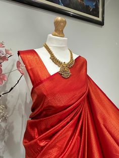 Discover the timeless beauty of our high-quality chilli red silk saree with copper zari all over the saree giving it a shiny finish. Perfect for any occasion(wedding or parties). An apt pick for wedding or any kind of occasion. Looks even better in real !  This saree comes with full finishing, falls and pico done and also with an unstitched blouse fabric, same fabric and colour as saree Elegant Red Pre-draped Saree For Puja, Elegant Red Raw Silk Pre-draped Saree, Elegant Red Pre-draped Saree With Self Design, Red Tussar Silk Pre-draped Saree For Wedding, Elegant Red Katan Silk Pre-draped Saree, Elegant Red Banarasi Silk Pre-draped Saree, Elegant Gold Paithani Silk Blouse Piece, Elegant Red Paithani Silk Pre-draped Saree, Gold Banarasi Silk Pre-draped Saree For Celebration