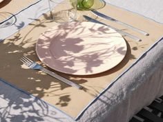 a table setting with plates and silverware