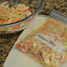 two bags of food sitting on top of a counter next to a bowl filled with rice