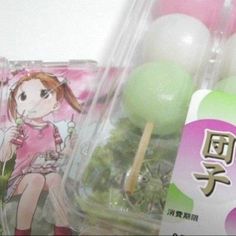 an assortment of food items in plastic containers on a shelf with chinese writing and characters