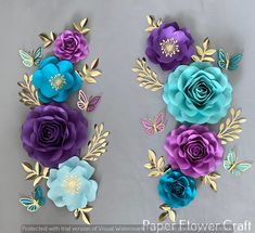 paper flowers are arranged in the shape of butterflies