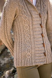 a woman wearing a cardigan sweater with buttons on the front and back, standing outside