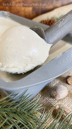 a scoop of ice cream sitting on top of a wooden table