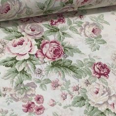 a floral fabric with pink and white flowers on it