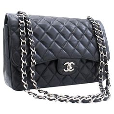 An authentic CHANEL Grained Calfskin Large Chain Shoulder Bag W Flap Silver Classic. The color is Black. The outside material is Leather. The pattern is Solid. This item is Contemporary. The year of manufacture would be 2015. Conditions & Ratings Outside material: Grained Calfskin (Caviar Leather) Color: Black Closure: Turn Lock Hardware and chain: Silver-Tone Made in France Serial sticker: Attached Comes with: Dust bag, Care booklet Overall: 8 of 10 - The outside is in excellent condition with Classic Formal Shoulder Bag With Pebbled Texture, Leather Business Bag With Chain Detail, Classic Travel Bags With Chain Detail, Business Leather Bag With Chain Detail, Classic Chain Bags For Daily Use, Elegant Pebbled Texture Shoulder Bag, Elegant Black Shoulder Bag With Grained Texture, Chain Silver, Double Chain