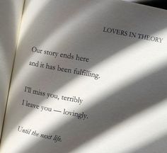 an open book with the words lovers in theory written on it's pages and shadows