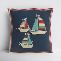 three sailboats on blue and red striped pillow