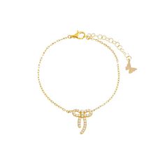 Enhance your elegance with the Petite Pave Bow Tie Pendant Bracelet from Adina Eden. Crafted from brass and plated with 14K gold, this bracelet features a dainty bow tie pendant adorned with sparkling clear CZ stones. The 10MM size adds a delicate touch, perfect for everyday wear or special occasions. With a length of 6" and a 1" extender, it offers a comfortable and adjustable fit for various wrist sizes. This versatile bracelet complements both casual and formal outfits, making it a timeless a Bow Tie Design, Formal Outfits, Tie Design, Pendant Bracelet, Chic Boutique, Cz Stone, Silver Bracelets, Bow Tie, Occasion Wear