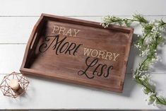 a wooden tray that says pray more worry less