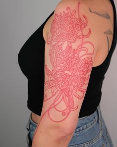 a woman with a tattoo on her arm